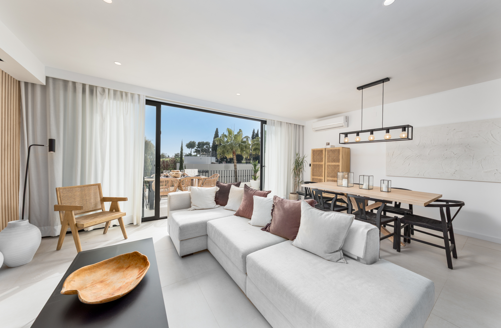 Spacious living and dining area with terrace access at Los Pinos de Aloha, Marbella