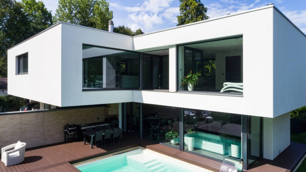 Modern luxury villa with private pool for sale in Estepona, Spain, featuring contemporary architecture and large glass windows — ideal for buyers searching for luxury villas Estepona is known for.